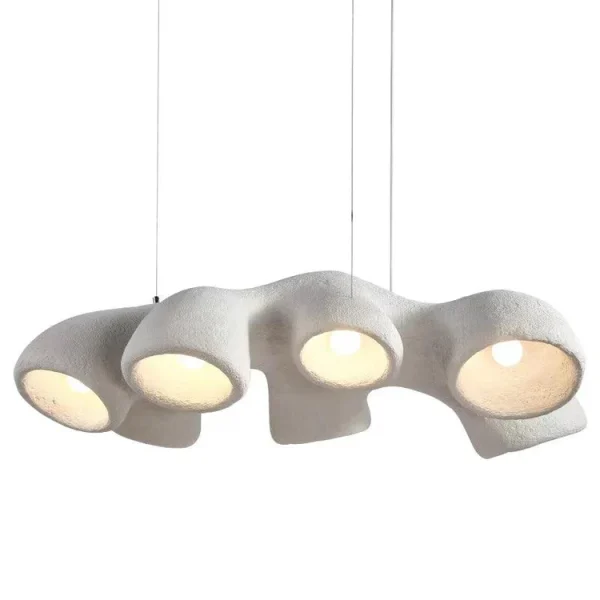 Textured white Wabi Sabi Coral Pendant Lamp with organic, rounded forms and warm glowing lights hangs in a minimalist, neutral-toned living space, enhancing the serene, Japandi-inspired aesthetic.